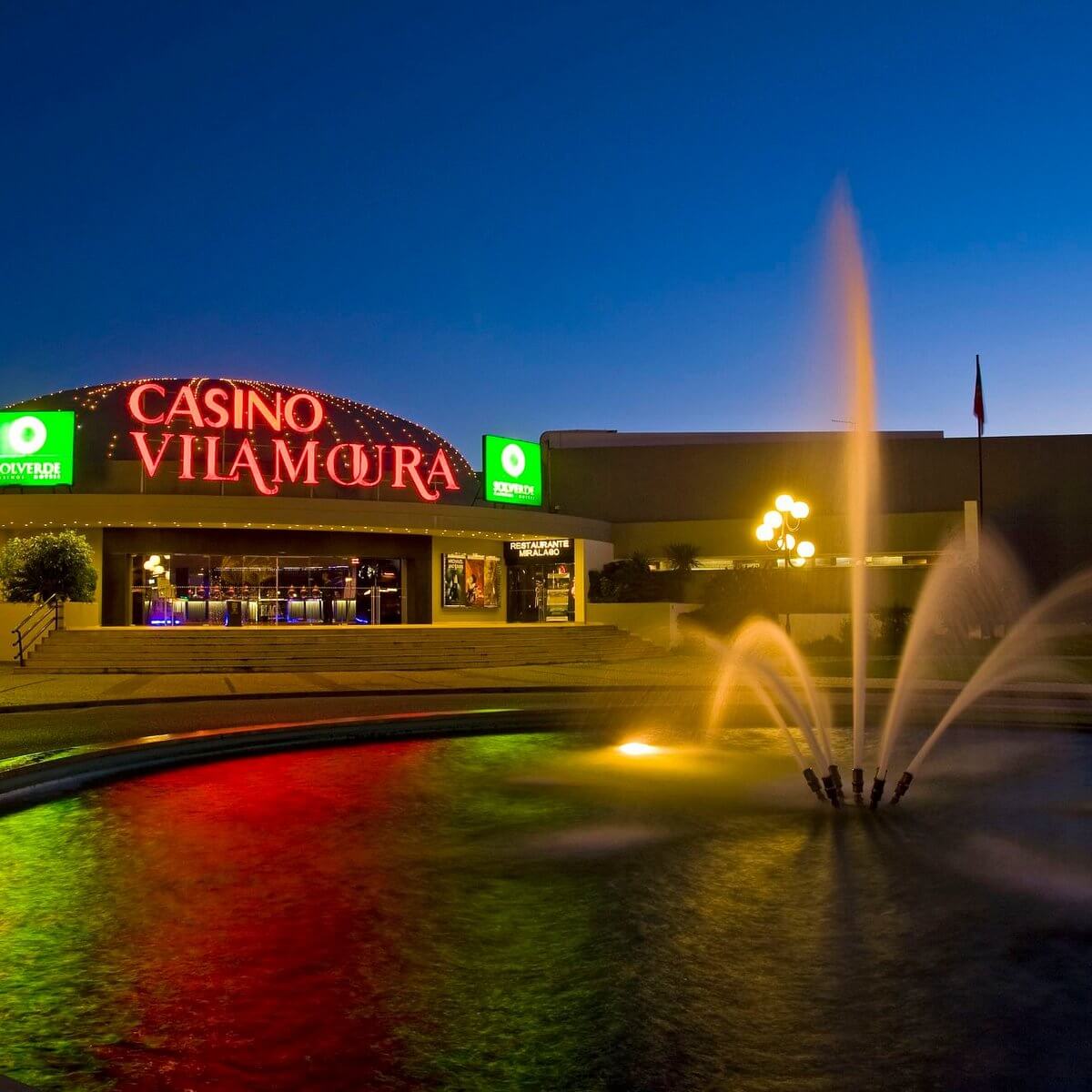 The bright, illuminated modern exterior architecture of Casino Vilamoura near the main resort centre