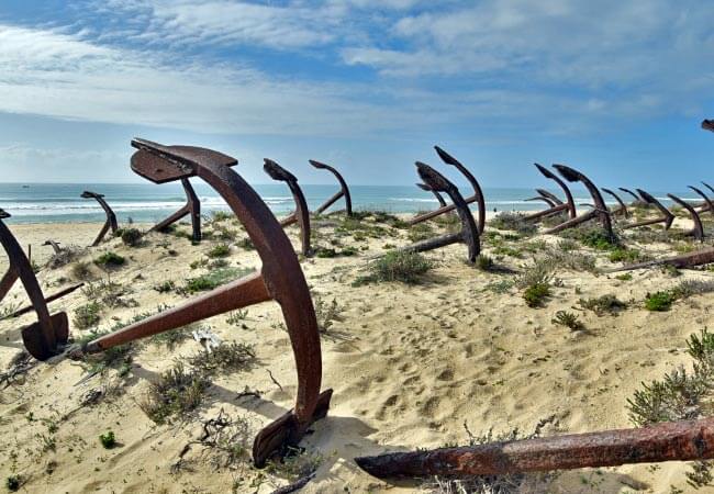 The unique anchor cemetery memorial sitting among the coastal dunes at Praia do Barril beach near Tavira