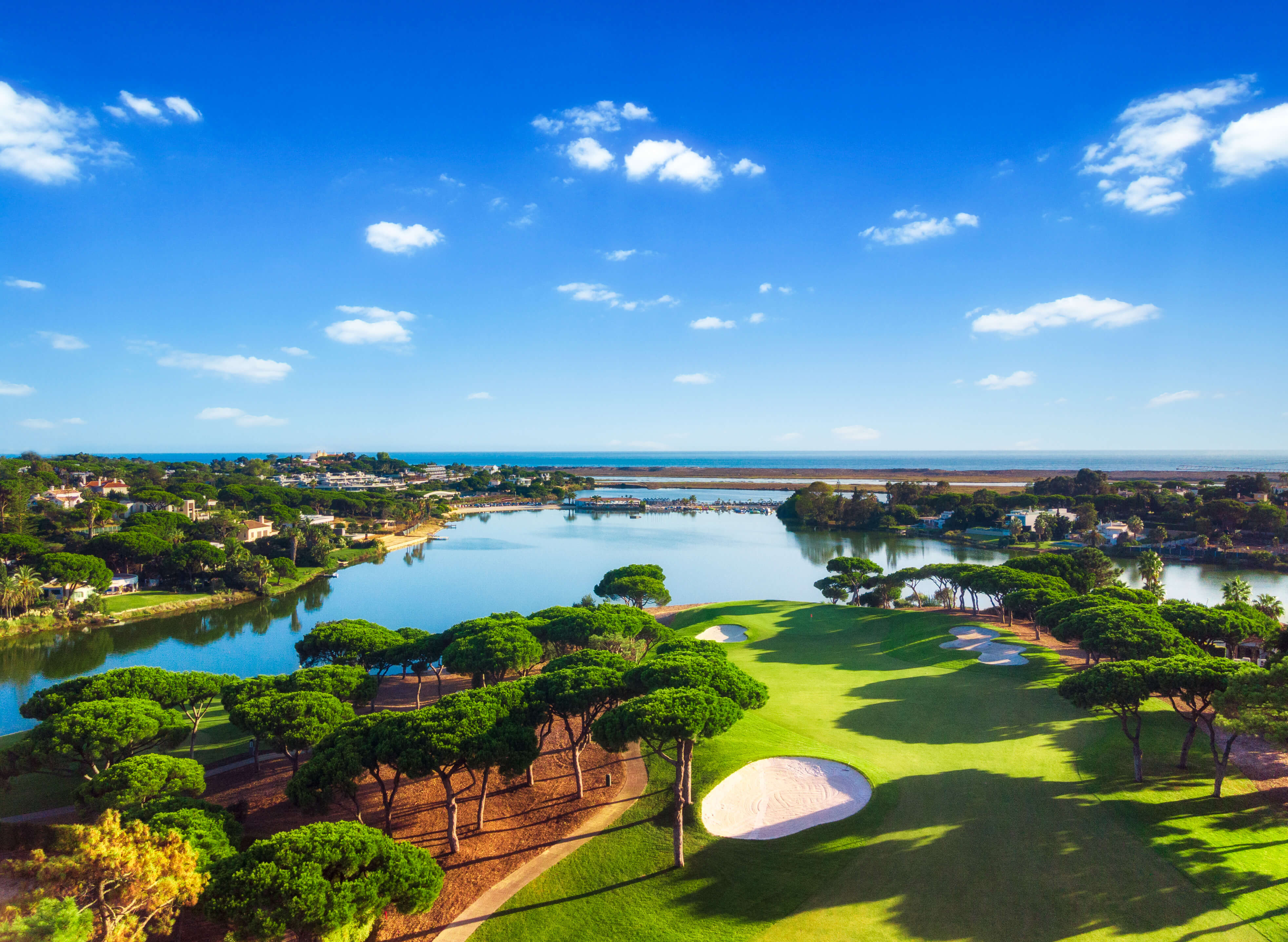 Scenic landscape looking across the fairways of Quinta do Lago South Course toward the lake edge